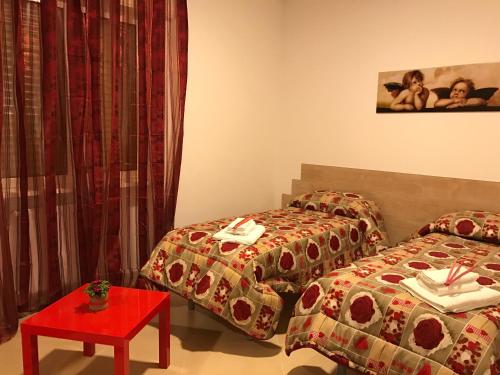 Ένα ή περισσότερα κρεβάτια σε δωμάτιο στο La Dolce Notte