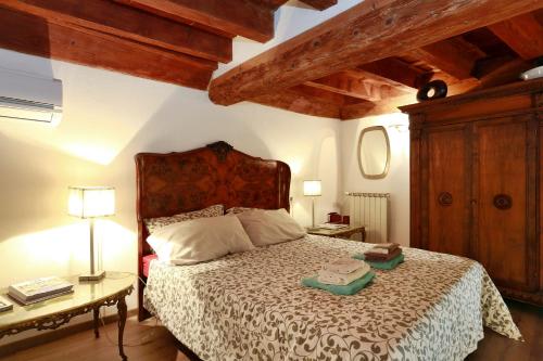 Кровать или кровати в номере Florence Pitti Loft