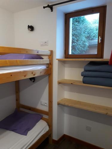 Ένα ή περισσότερα κρεβάτια σε δωμάτιο στο Chalet Les Garands