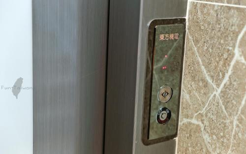 a close up of a door with buttons on it at 宜蘭莫內花園城堡 in Wujie