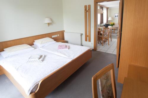 Ένα ή περισσότερα κρεβάτια σε δωμάτιο στο Appartements Oswald