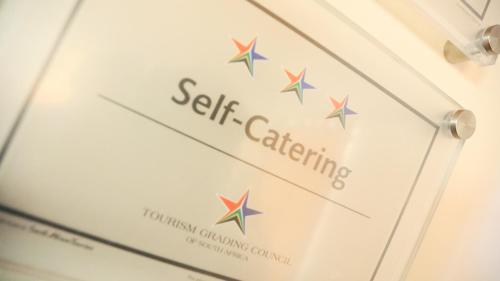 a sign that says seize catering with stars on it at Jock-Sabie Lodge in Sabie