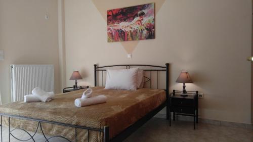 מיטה או מיטות בחדר ב-Avantis Apartments