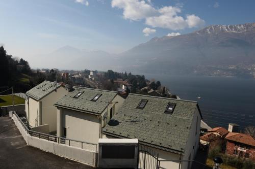 a view of a house with a view of a lake at Casa MICHI in Dervio