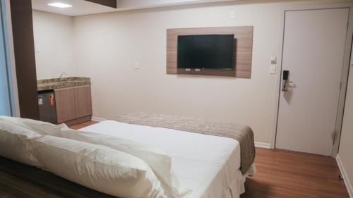 Ένα ή περισσότερα κρεβάτια σε δωμάτιο στο Hotel Golden Inn Lafaiete