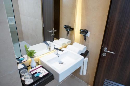 Koupelna v ubytování Adhiwangsa Hotel