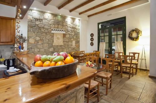 a bowl of fruit on a counter in a kitchen at Artemis Hotel in Delfoi