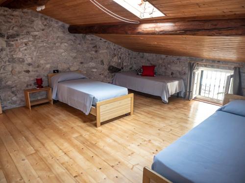Кровать или кровати в номере Casa Rustica - Appartamenti Pilati