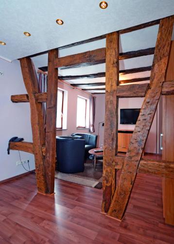 a living room with wooden beams at Hotel Gästehaus auf der Lay in Beilstein