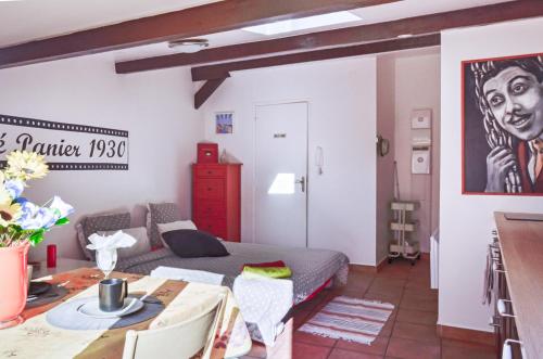 a living room with a couch and a table at Studio Panier 1930 in Marseille