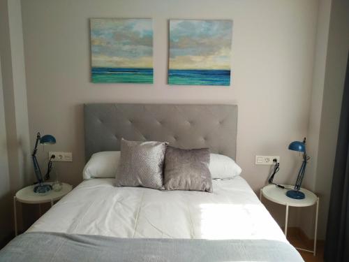 Кровать или кровати в номере Apartamentos Prestin