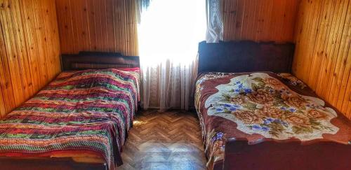 Postel nebo postele na pokoji v ubytování Guest House Buba