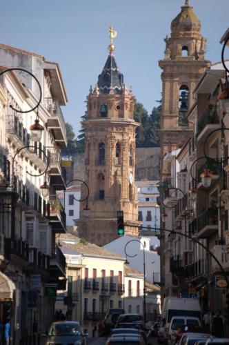 a city street with buildings and two towers at LA ATALAYA GREAT LUXURY ATTIC in Antequera
