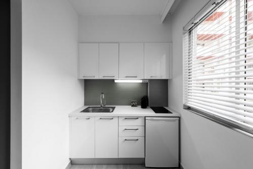 Virtuvė arba virtuvėlė apgyvendinimo įstaigoje M&F Luxury Suites est. 2019 / F Suite