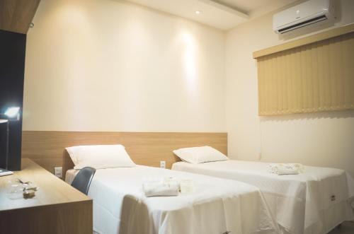 Ένα ή περισσότερα κρεβάτια σε δωμάτιο στο Hotel Ribeira dos Icós