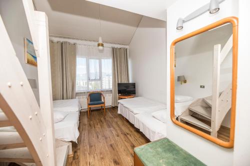 Postel nebo postele na pokoji v ubytování Hotel Orkin
