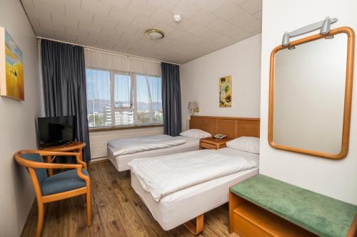 Postel nebo postele na pokoji v ubytování Hotel Orkin