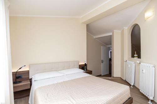 Cama o camas de una habitación en Scaligero Rooms