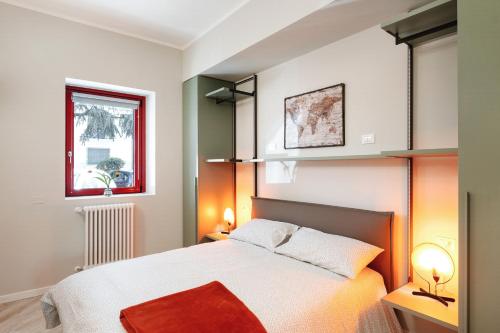Ένα ή περισσότερα κρεβάτια σε δωμάτιο στο Maggiore Residence Flats