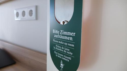 a sign on a door that reads blue lantern equipment at ST Michael Atrona GmbH in Euskirchen