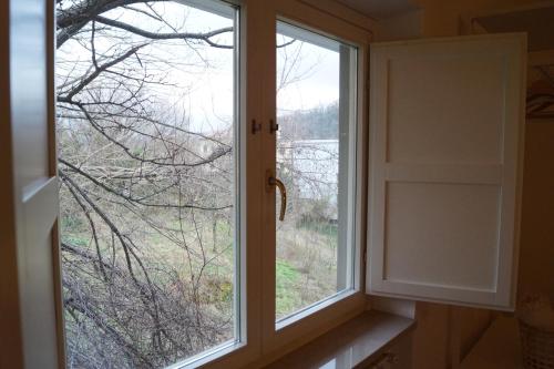 two windows in a room with a view at Bonjour Bonheur in Avellino