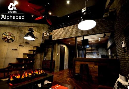 a restaurant with a fireplace and lights in a room at Alphabed SunportTakamatsu 701 / Vacation STAY 21860 in Takamatsu
