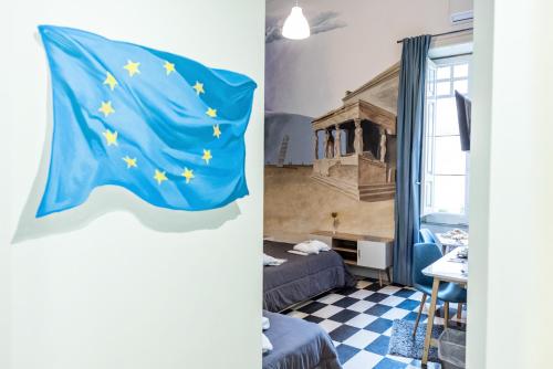 a room with a flag of the european union at Giro nel mondo in Catania