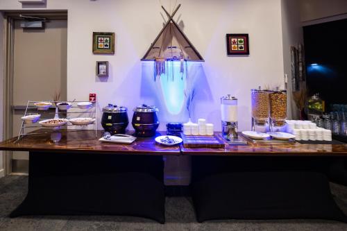 a table with a bunch of items on it at Grey Eagle Resort in Calgary