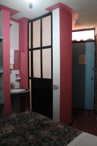 Hotel Posada Chamacueroにあるベッド