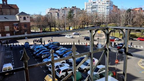 a parking lot full of cars parked in a parking lot at Pensión Sandoval by gaiarooms in León