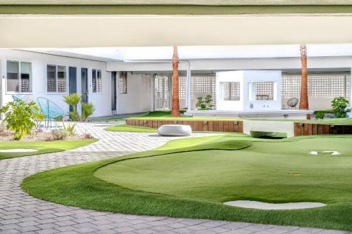 a golf course in front of a house at Downtowner Boutique Hotel in Las Vegas