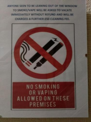 a sign that says no smoking or wavering frequencies at Lynmoore Guest House in Blackpool
