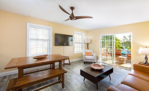 a living room with a table and a couch at Lime Tree Bay Resort in Islamorada