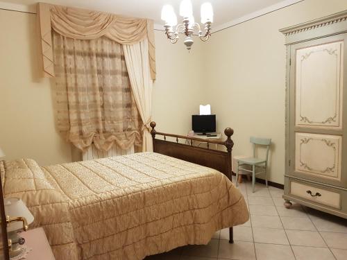 Кровать или кровати в номере Via del Fusato 13 Casa Carla
