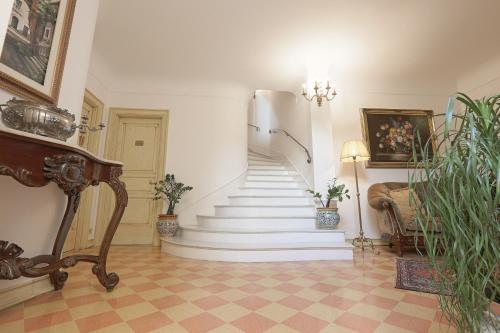 a stairway with white steps and a stair case at Atenea Luxury Suites in Agrigento