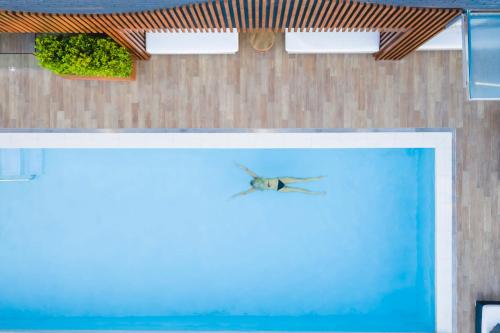 a bird is flying over a swimming pool at Mercure Brisbane King George Square in Brisbane