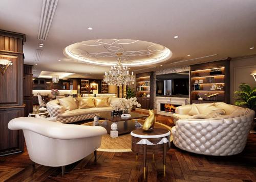 a living room with white furniture and a chandelier at Wyndham Garden Hanoi in Hanoi