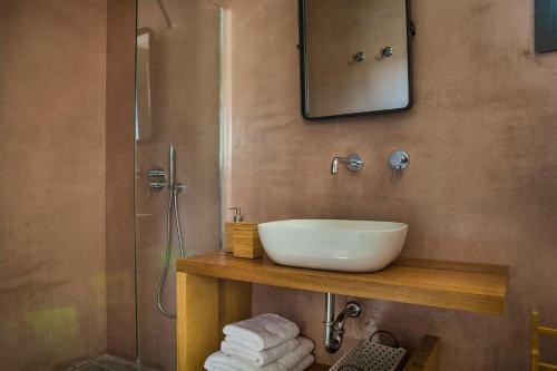 a bathroom with a sink and a shower at Villa Daniela - Saint Nikolas Retreat in Faraklata