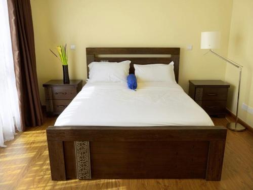 Postel nebo postele na pokoji v ubytování Royal pine cottage hotel