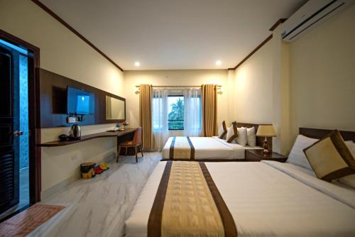 TV tai viihdekeskus majoituspaikassa Premier Vang Vieng Hotel