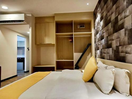 Ένα ή περισσότερα κρεβάτια σε δωμάτιο στο Kidurong Inn