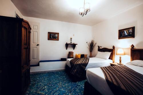 Katil atau katil-katil dalam bilik di Hostal Plaza Central