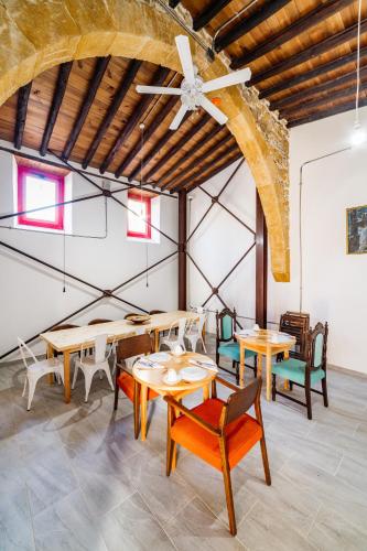 a room with tables and chairs and a ceiling at NICOSIA EAGLE EYE in North Nicosia