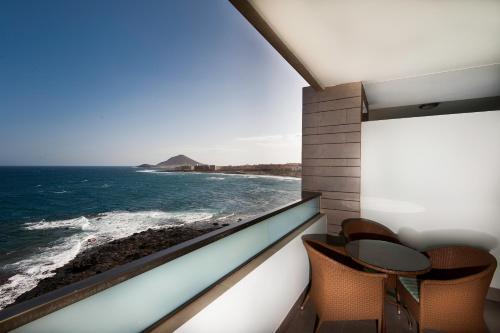 a view out of a window of a boat on a beach at Kn Hotel Arenas del Mar Adults Only in El Médano