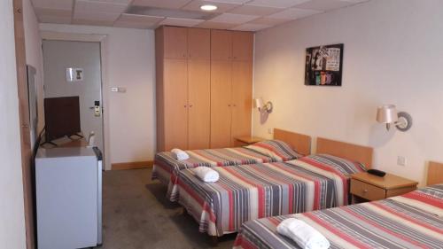 Katil atau katil-katil dalam bilik di Tropicana Hotel
