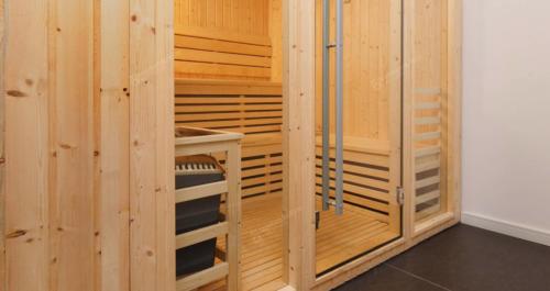 a wooden sauna with wooden walls and wooden shelves at Torre One II Punta Del Este in Punta del Este