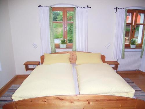 Un pat sau paturi într-o cameră la Hanauerhof