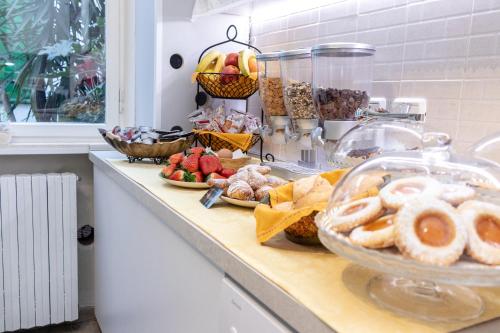 a counter top with a bunch of food on it at B&B Accademia in Verona