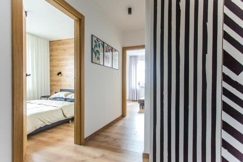 En eller flere senger på et rom på Apartament Nadbystrzycka no. 13