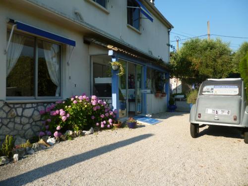 a small car parked in front of a building at Hotel Cayrons Vence & St Paul de Vence in Vence